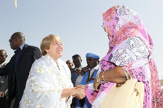 Michelle Bachelet greets a woman