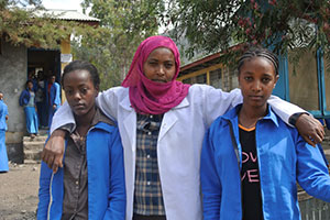 School gender-club members Eden and Abeba with the teacher and leader Lubaba at Woldia General Secondary School in the Amhara region of northern Ethiopia.   Photo: UN Women/ Kristin Ivarsson