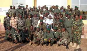 A group of armed forces personnel pose after the conclusion of one of the first training sessions at the Alioune Blondin Beye Peacekeeping School in Bamako on 20 January. Photo credit: UN Women / DIRPA