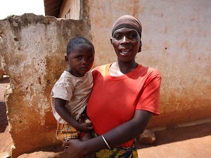 28-year-old water kiosk supervisor Scholastika says she is happy to work for the benefit of her community and to give her son a better future.