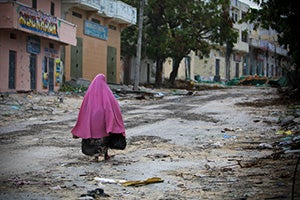 A Somali woman walks through the deserted streets of Bakara Market in central Mogadishu, a city that has endured decades of conflict.