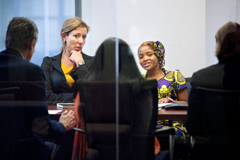 Former Representative for UN Women's Country Office in Mozambique, Valeria Campos Mello (left), translates for Raquelina. Photo: UN Women/Ryan Brown