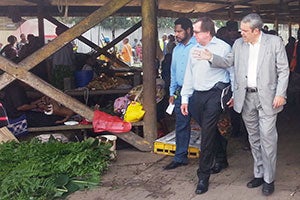 New Zealand Minister for Foreign Affairs and Trade, Murray McCully; Minister for Sports and Pacific Games, Justin Tkachenko, and Deputy City Manager, Honk Kiap, surveying the conditions of Gordons market. Photo: UN Women/Michelle Alexander