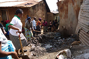 Unclogging the drains; the Galima women conduct a community cleanup campaign