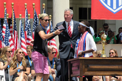 U.S. women's national team soccer player Abby Wambach accepts a key to the city. 