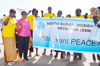 Upon her arrival in Juba, South Sudan UN Women Executive Director Phumzile Mlambo-Ngcuka is welcomed by women from the South Sudan Women's Network who passionately told her they want peace.  Photo: UN Women/Rose Ogala