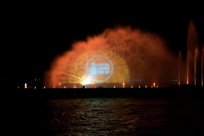 Orange messages were flashed across spraying water on the Bosphorus Strait in Istanbul on 10 December 2015. Photo: UN Women/Ventura Formicone