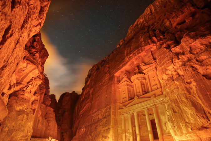 The UNESCO World Heritage archeological site of Petra, in Jordan, was lit in orange on 25 November. Photo: UN Women/Christopher Herwig