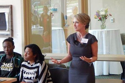 Sharon Reed, 47, giving keynote speech at UNC-Charlotte for International Women's Day. Photo credit: UNCC Office of International Programmes.