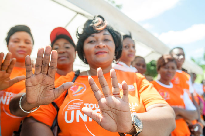 Women say “No” to violence at an orange caravan in Kinshasa, DRC. Photo: UN Women/Catianne Tijerina