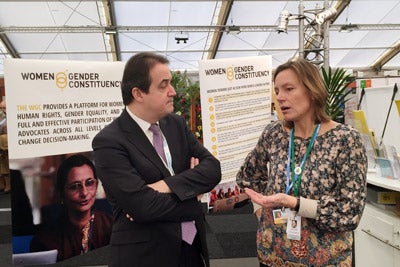 UN Women Deputy Executive Director Yannick Glemarec visits civil society stalls at COP 21’s Climate Generations area. Photo: UN Women.