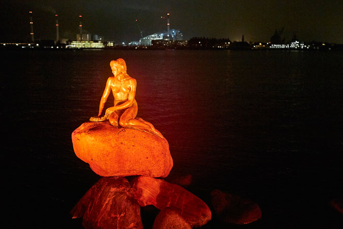 Denmark’s Little Mermaid statue was lit in orange on the eve of International Day for the Elimination of Violence against Women, 25 November 2015. Photo: UN Women/Anders M. Kjemtrup  