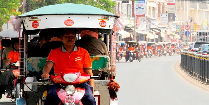 Over 50 tuk-tuks taking part in the Orange Day parade in Phnom Penh. Photo: Mariken B. Harbitz/UN Women Cambodia