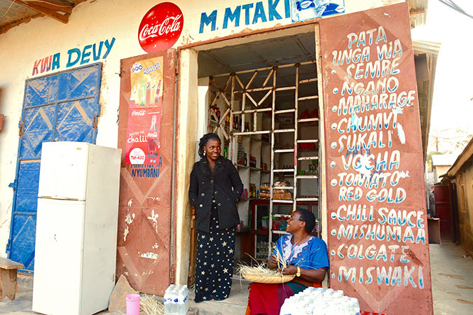 Mary Mtaki with her mother at their Tunduma store, Tanzania.    Photo: UN Women Tanzania/Deepika Nath