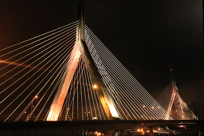 Boston's landmark Zakim Bridge was lit in orange to raise awareness about the 16 Days of Activism and ending violence against women in the United States. Photo: Angela Simonelli