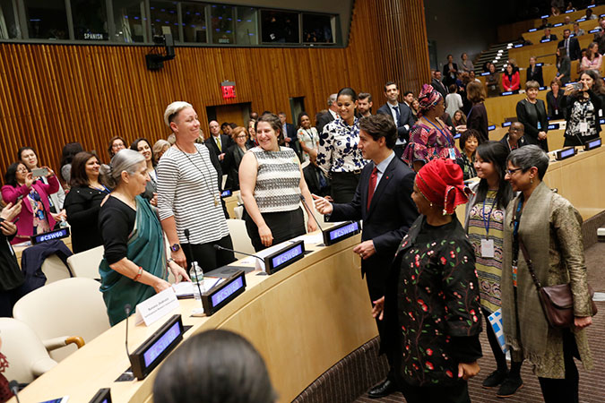 Canadian Prime Minister Justin Trudeau greets U.S. football icon Abby Wambach at UN Women's High-Level Event on Gender Equality and Global Call to Action on Equal Pay. Photo: UN Women/Ryan Brown