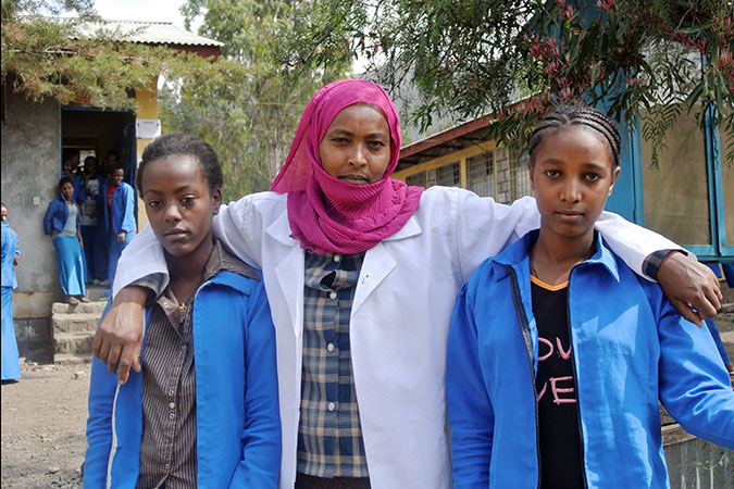In 2013 the initiative supported school gender-clubs, where students regularly come together to discuss how to prevent violence against women in school communities. School gender-club members Eden and Abeba with the teacher and leader Lubaba at Woldia General Secondary School in the Amhara region of northern Ethiopia. Photo: UN Women/Kristin Ivarsson 