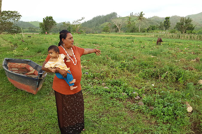 Raj Wati points to what remains of her pawpaw plantation in Sigatoka. Photo: UN Women/Kasanita Isimeli.
