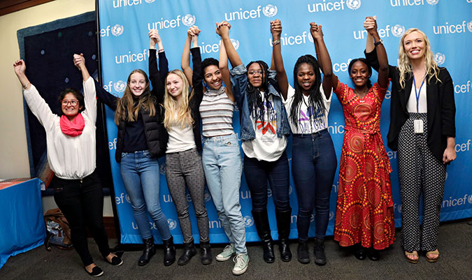 Attendees celebrate Girl Power in the Photo Booth set up on the occasion of the International Day of the Girl Child on 11 October 2016. Photo: UN Women/Ryan Brown