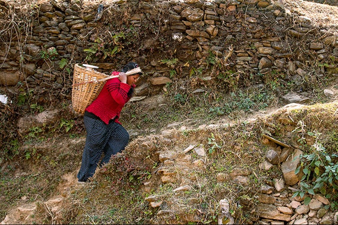 Kalpana Shrestha doing her day-to-day chores in Sanosirubari VDC-2 at her home in Chautara, Sindhupalchwo, Nepal. Photo: UN Women/N. Shrestha