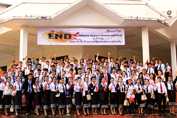 Students at National University of Laos show their commitment to ending violence against women with orange ribbons. Photo: UNDP/Heidi Sairanen