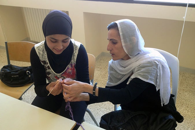 Hiba Kamal, a Syrian refugee, learns needlework technique from a Lebanese woman at a workshop by Amel Foundation, supported by UN Women Fund for Gender Equality. Photo courtesy of Amel Foundation