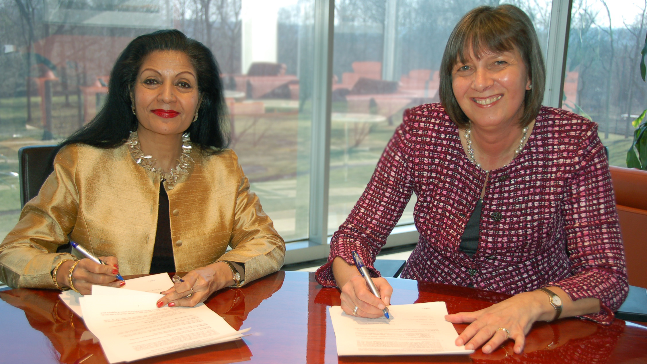 In Purchase NY, MasterCard’s CFO, Martina Hund-Mejean signs a Memorandum of Understanding (MOU), with Lakshmi Puri, United Nations Assistant Secretary-General Deputy Executive Director.