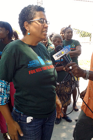 Nadege Beauvil speaks to the media at a rally with women associations and the Ministry of Women Affairs on 7 August, 2015, two days ahead of the elections. Photo: UN Women/Alide Andral