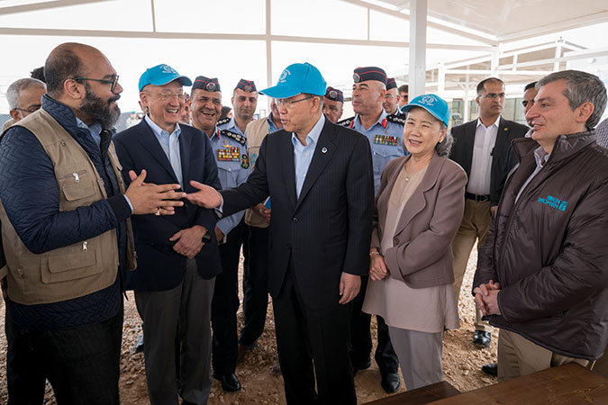 From left to right, Mohammad Naciri, UN Women’s Regional Director for Arab States, Jim Yong Kim, Director of the World Bank, Ban Ki-moon, Secretary-General of the United Nations, and Mr. Ban’s wife, Ms. Yoo (Ban) Soon-taek, during a visit to one of UN Women’s “Oases” in Za’atari refugee camp. Photo: UN Women/Christopher Herwig 