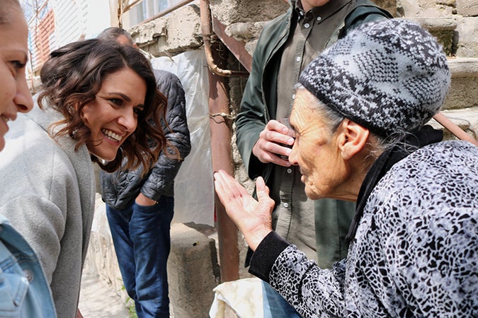 Catherine Wolf, Programme Analyst with UN Women’s Fund for Gender Equality, and Zabel Hayruni of Green Lane talking to  beneficiaries in the community of Aghavnadzor. Photo: Green Lane/Armen Sarukhanyan