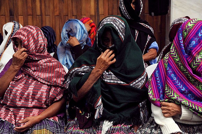 “The Sepur Zarco Grandmothers” wait for a verdict during the trial of  former military officers for crimes against humanity on counts of rape, murder and slavery in Guatemala’s High-Risk Court. Photo: Cristina Chinquin 