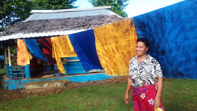 Luisa Siaos with traditional hand-painted cotton fabric or “elei lavava.” Photos courtesy of Samoa Victim Support Group. 