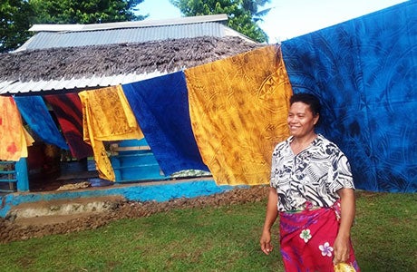 Luisa Siaos with traditional hand-painted cotton fabric or “elei lavava.” Photos courtesy of Samoa Victim Support Group. 