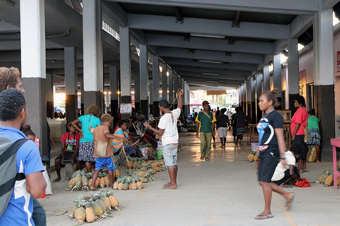 Market vendors wrapping up for the day at Auki Market, Solomon Islands. Photo credit: UN Women/Caitlin Clifford