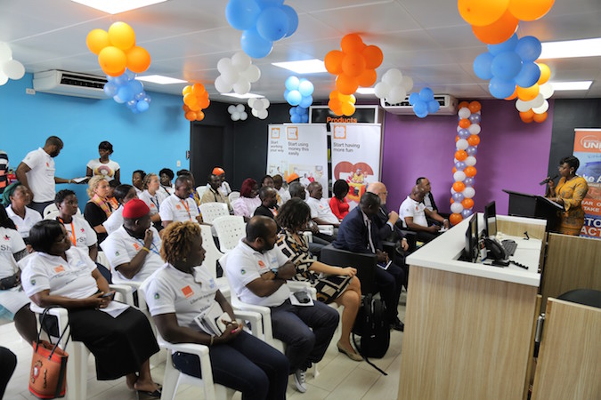 UN Women and Orange Liberia celebrate the launch of a new partnership. UN Women/Winston Daryoue