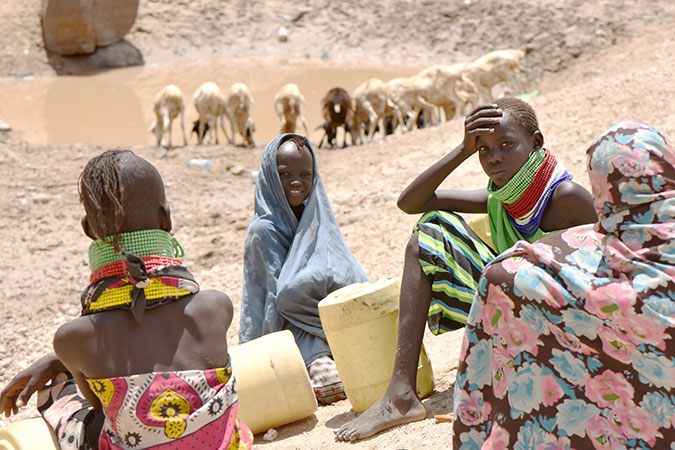 A dry river bed serves as a waterpoint for both humans and livestock. Photo: UN Women/Kennedy Okoth