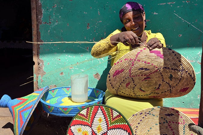 Tadelech Bekelpe weaving her hand-made baskets. Photo: UN Women/Fikerte Abebe