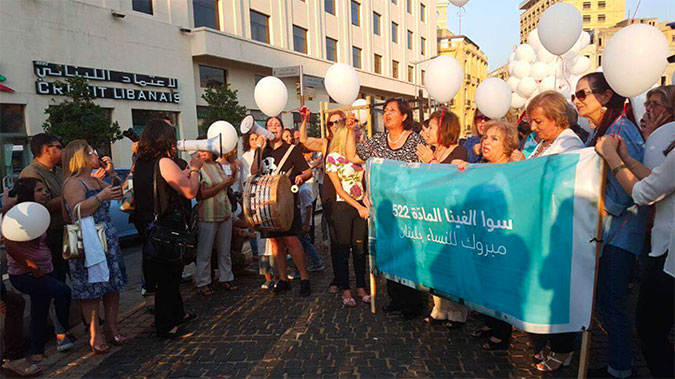 Civil society activists from ABAAD, the Lebanese Women Council, and others gather outside of the parliament building in Beirut to celebrate the abolishment of article 522 from the Lebanese Penal Code on 17 August 2017. Photo: ABAAD