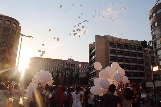 Civil society activists from ABAAD, the Lebanese Women Council, and others gather outside of the parliament building in Beirut to celebrate the abolishment of article 522 from the Lebanese Penal Code on 17 August 2017. Photo: ABAAD