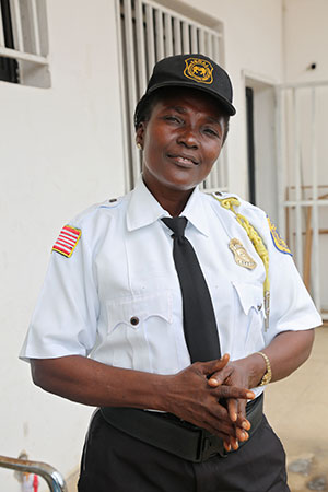  43-years old Annie Emmons, a private security officer. Photo: UN Women/Winston Daryoue 