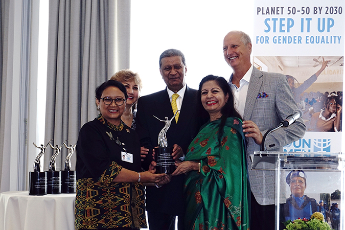 Retno Marsudi, Minister of Foreign Affairs of the Republic of Indonesia (front left) receives the Women of Achievement Award from President of Global Partnerships Forum, Amir Dossal (center) and UN Women Deputy Executive Directory Lakshmi Puri. Photo: Aditya Wicaksono