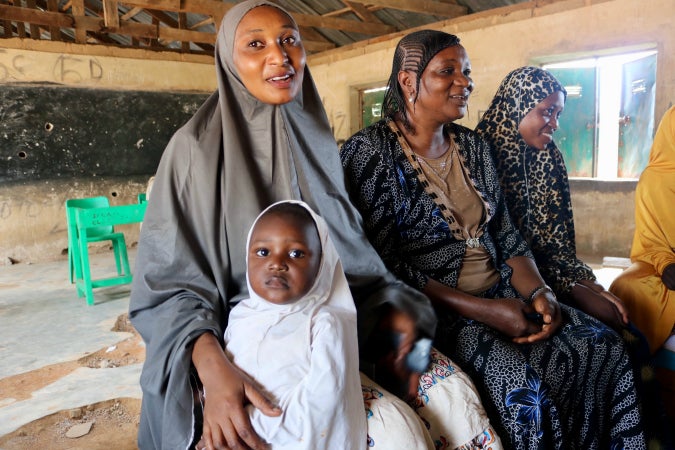 Aisha Usman, leader of the Farin Gada peace network and Agnes Wanpe, deputy leader of the network with a member of the network. Photo: UN Women/Ladi Eguche