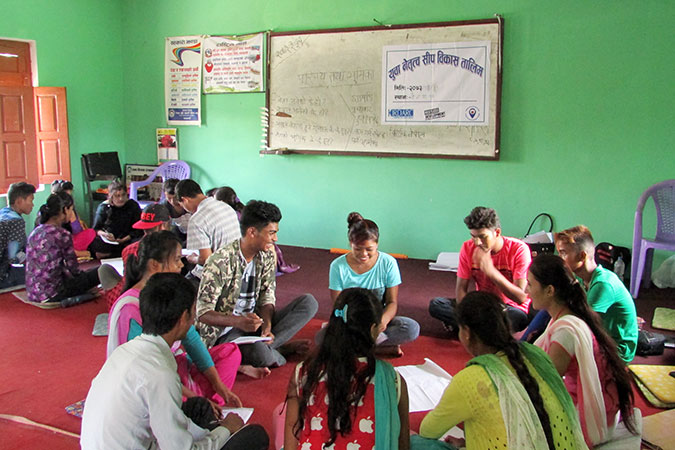 A group discusses leadership training to Youth clubs on the harmful traditional practice of chhaupadi. Photo: Restless Development Nepal