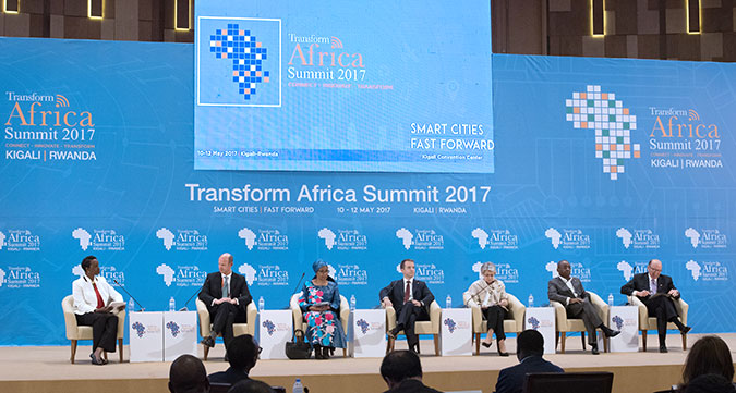 L-R: Moderator Crystal Rugege, Director of Business Strategy and Operations, Carnegie Mellon University - Africa, Russian Federation Minister of Telecom & Mass Communications Nikolay Nikiforov, UN Women Executive Director Phumzile Mlambo-Ngcuka, Inmarsat CEO Rupert Pearce, UNESCO Director General Irina Bokova, Econoet Executive Chairman Strive Masiyiwa and Carnegie Mellon University President Emeritus and University Professor of Civil and Environmental Engineering & Engineering and Public Policy Jared Cohon during a panel discussion of the opening ceremony of the Transform Africa Summit. Photo: UN Women/Franz Stapelberg