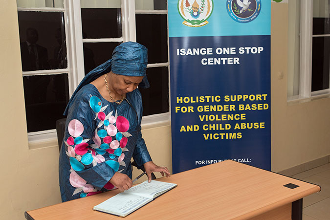 Phumzile Mlambo-Ngcuka, Executive Director of UN Women, signing the visitor’s book at the Isange Center. Photo: UN Women/Franz Stapelberg