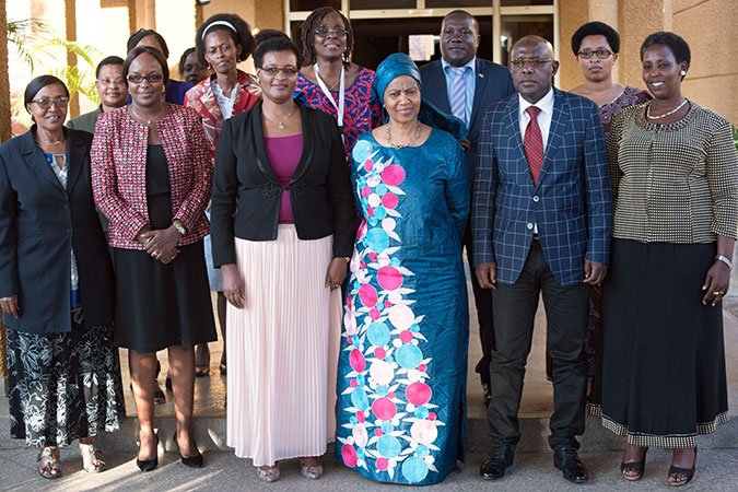 Phumzile Mlambo-Ngcuka, Executive Director of UN Women, and the Speaker of the Chamber of Deputies, Mukabalisa Donatille, with various parliamentarians pose for a group picture outside parliament. Photo: UN Women/Franz Stapelberg