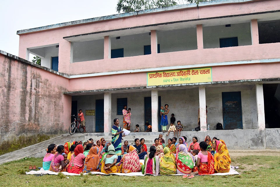 Talamai Soren speaking about the women rights awareness to village women during a meeting at Lamba Basti village in Kishanganj district in Bihar, India. Photo: UN Women/Biju Boro