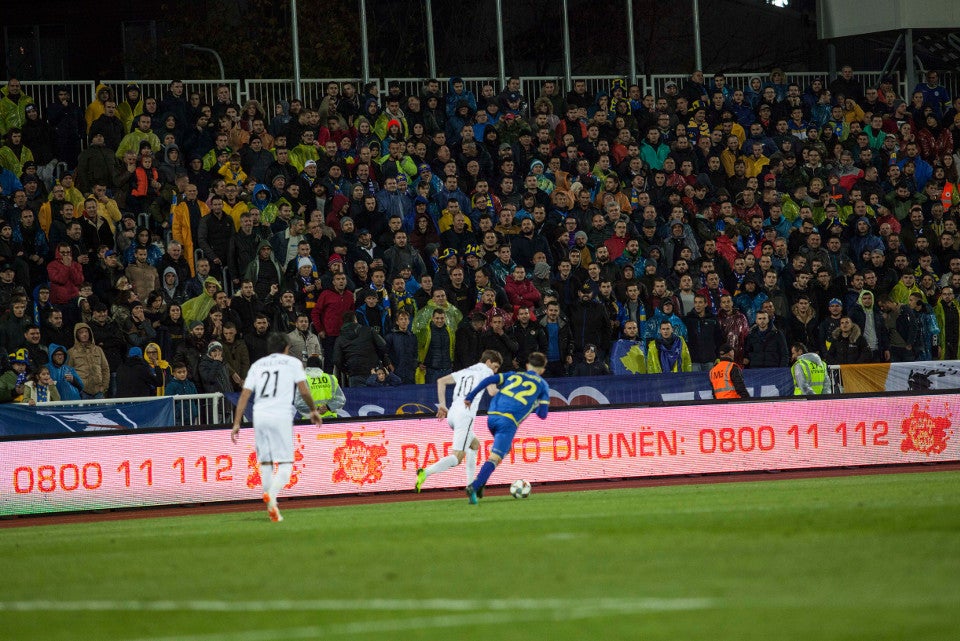 Campaign slogans on pitchside LED billboards during match. Photo: UN Kosovo
