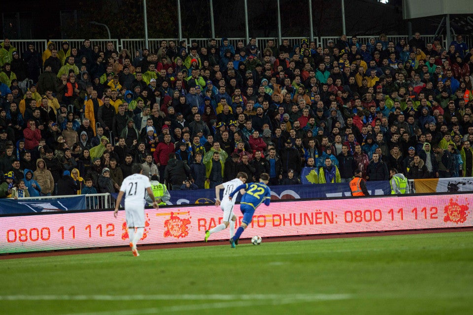 Campaign slogans on pitchside LED billboards during match. Photo: UN Kosovo 