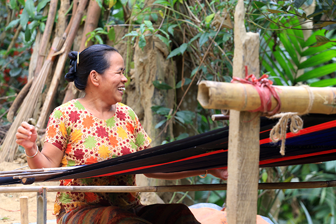 Bojjropodi Chakma learned to weave handlook products to supplement her income. Photo: UN Women/Jewel Chakma